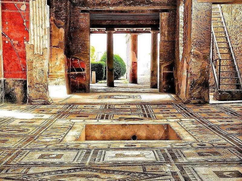 The atrium of a house at Pompeii, its impluvium open to the sky and a planted garden beyond