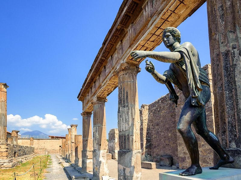 A bronze figure beside the colonnade of the Sanctuary of Apollo at Pompeii