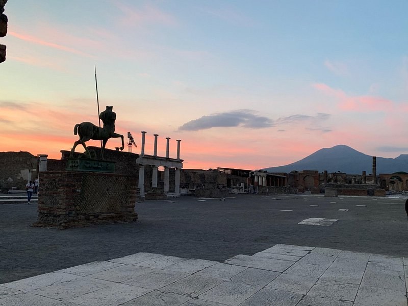 The empty Forum at Pompeii at dawn, Vesuvius low on the horizon behind the columns