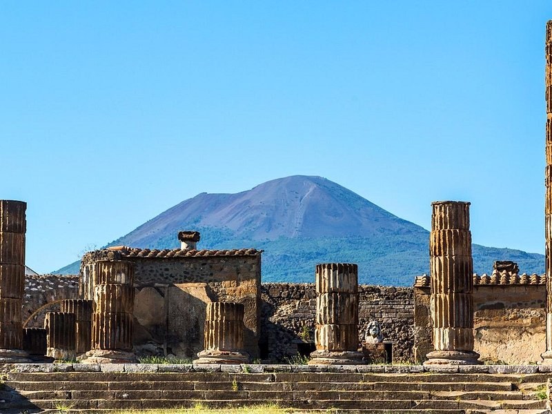 Columns at the north end of the Forum at Pompeii, Mount Vesuvius closing the view