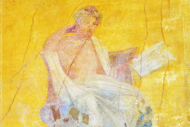 A wall painting of a seated figure on a yellow ground at Pompeii